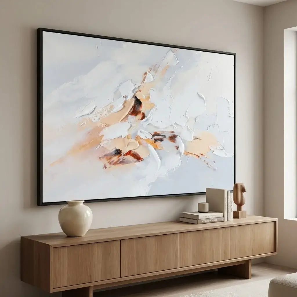 Abstract painting on a wall above a wooden console table in a room.
