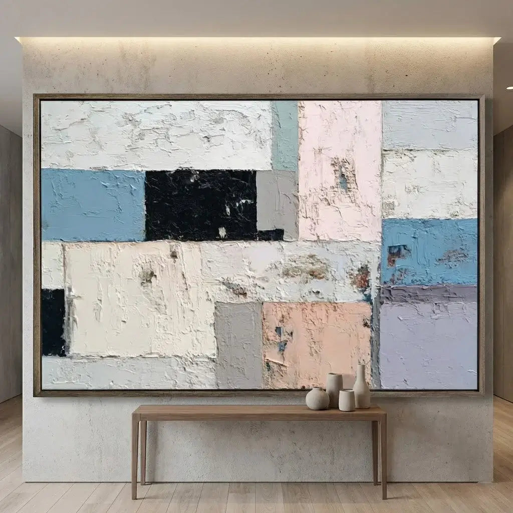 Abstract art piece on a wall with a console table below