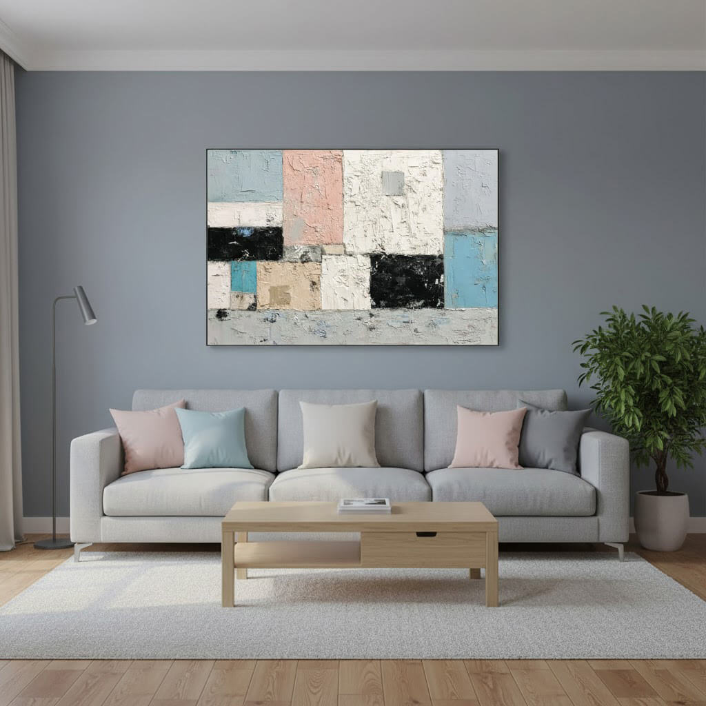 Living room with a gray sofa, wooden coffee table, and abstract art on the wall.