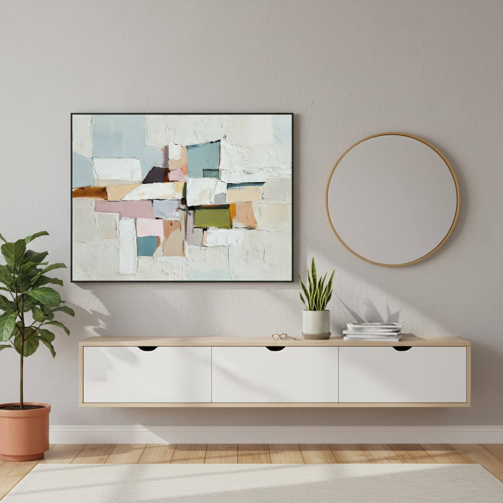 Modern living room with a colorful abstract painting, round mirror, and white console table.