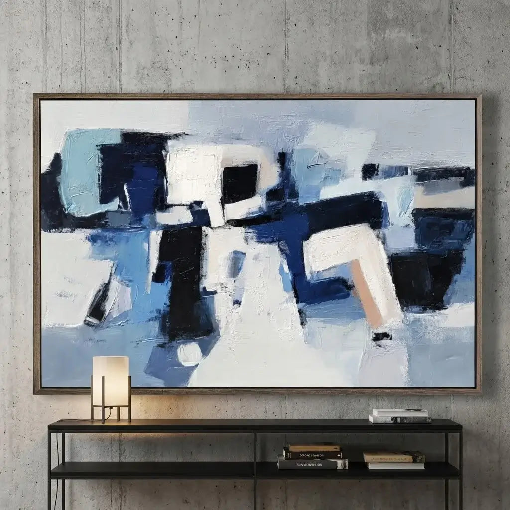 Abstract art piece on a concrete wall with a console table below.
