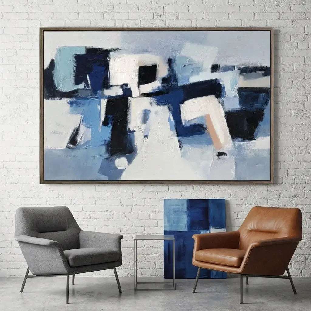 Abstract painting in a modern living room with two chairs and a side table.