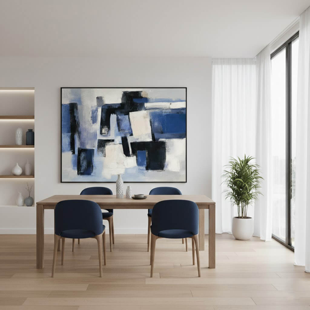 Modern dining room with a abstract painting on the wall, wooden table, and blue chairs.