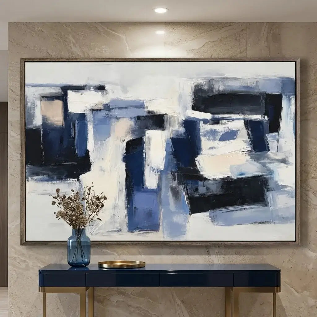 Abstract painting on a wall above a console table with decorative items.