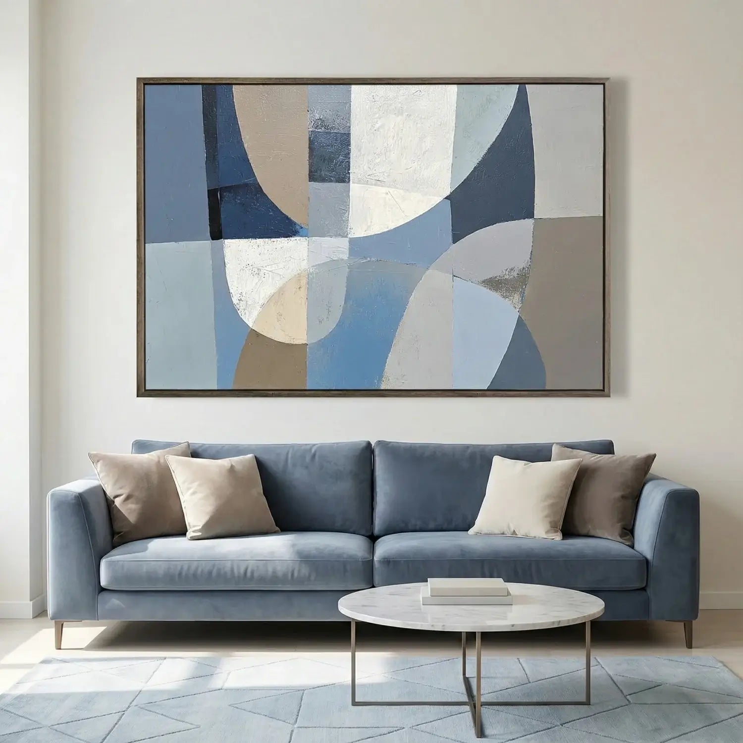 Modern living room with a blue sofa, abstract art, and a coffee table.