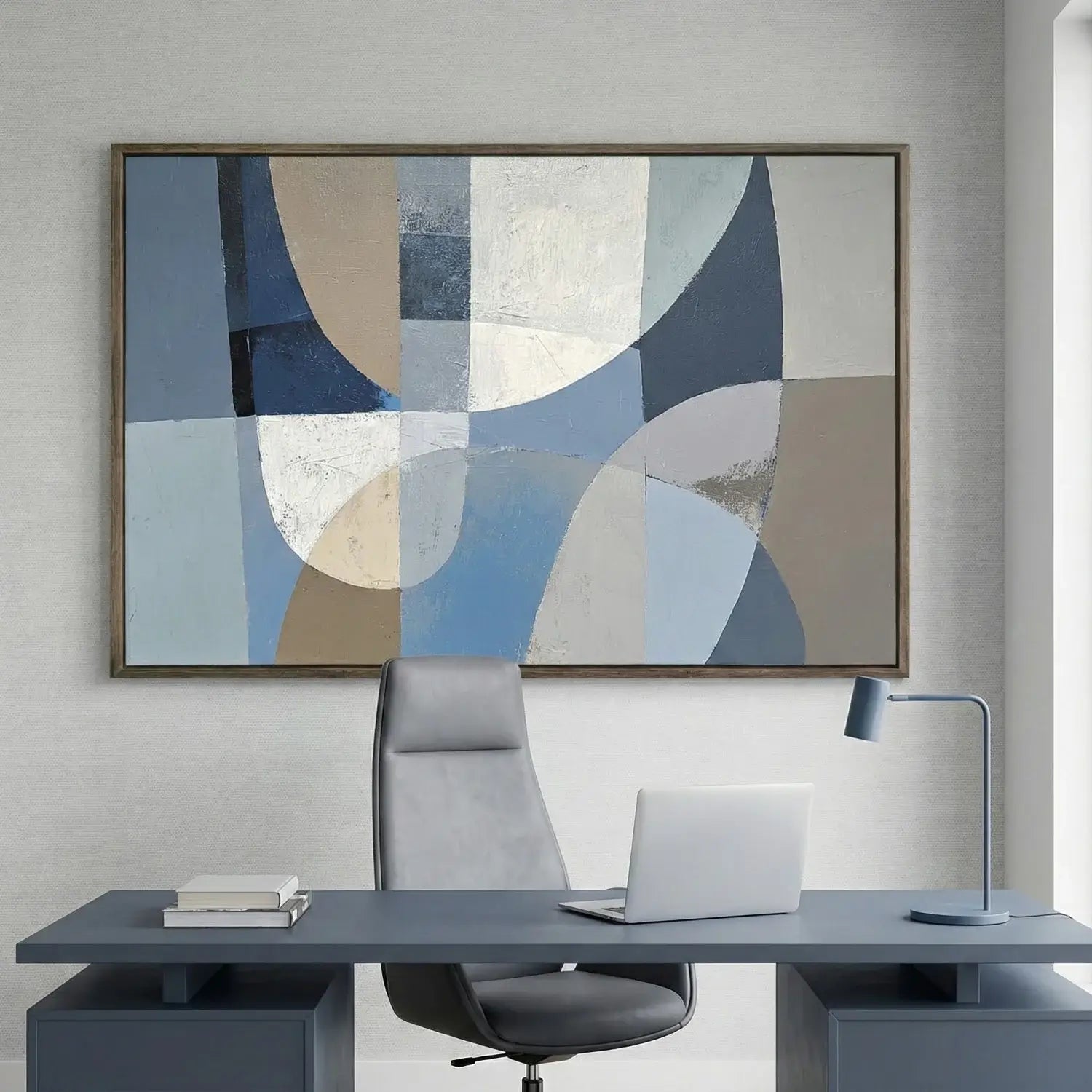 Modern office setup with a desk, chair, and abstract art on the wall.