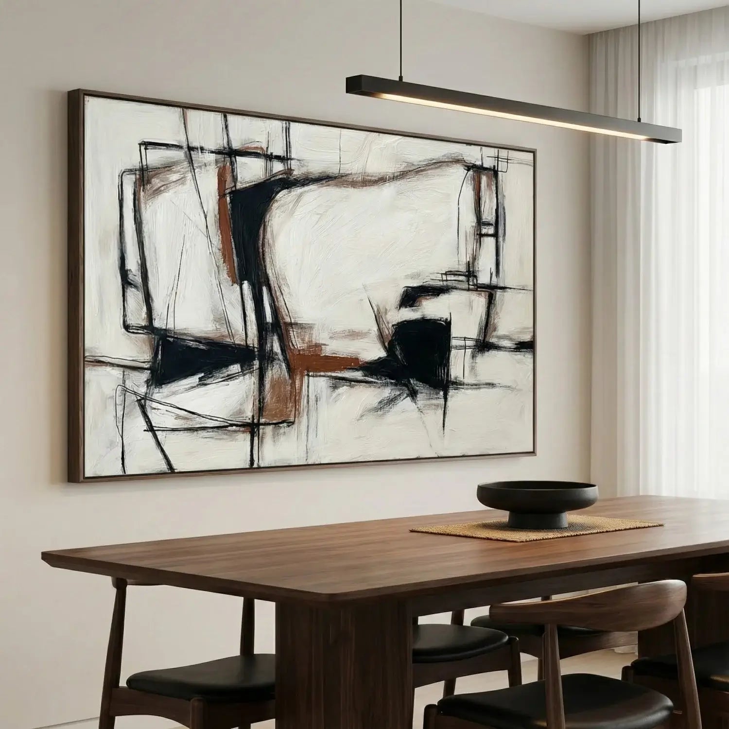 Abstract painting on a wall above a wooden dining table with chairs.
