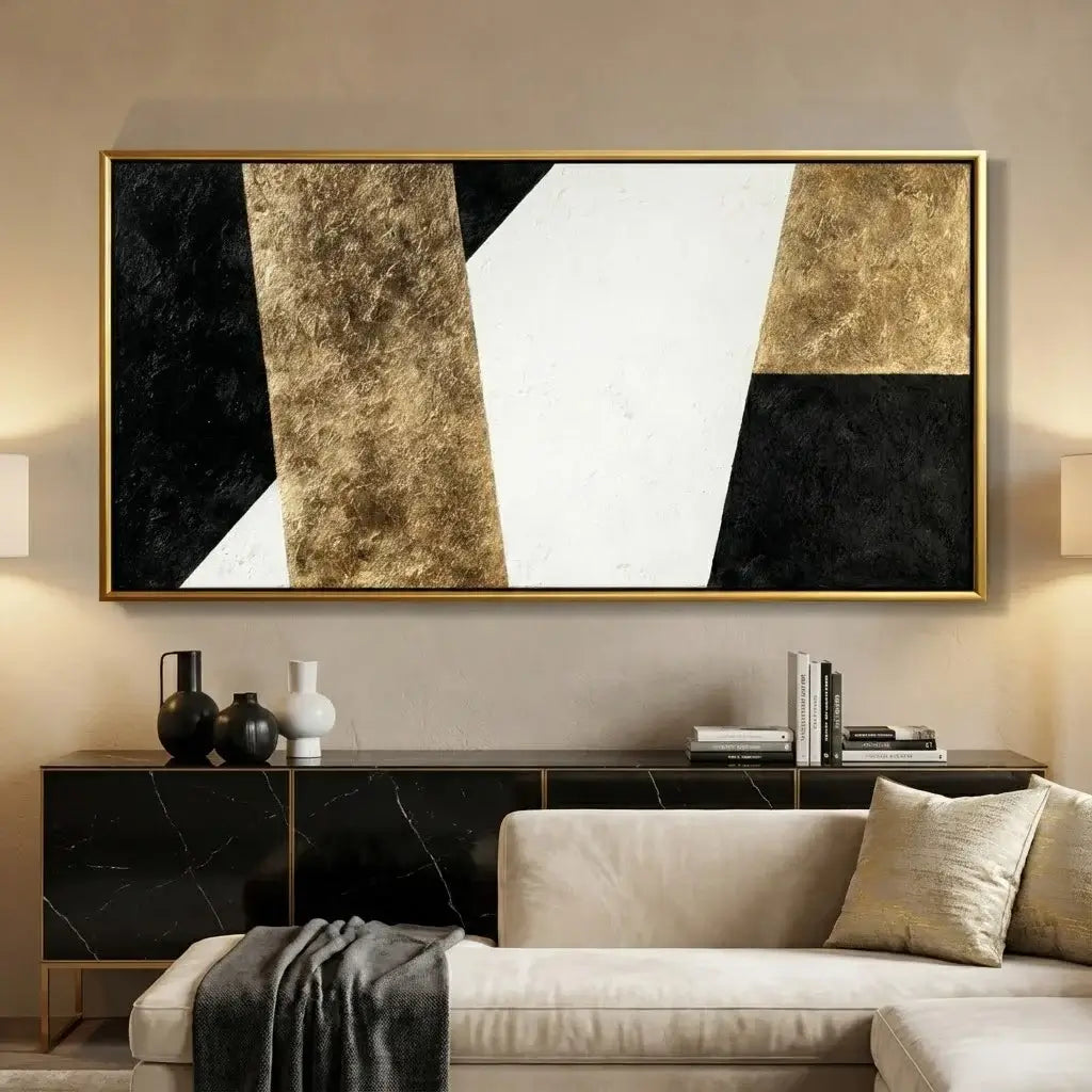 Abstract art piece in a modern living room setting with a sofa and side table.
