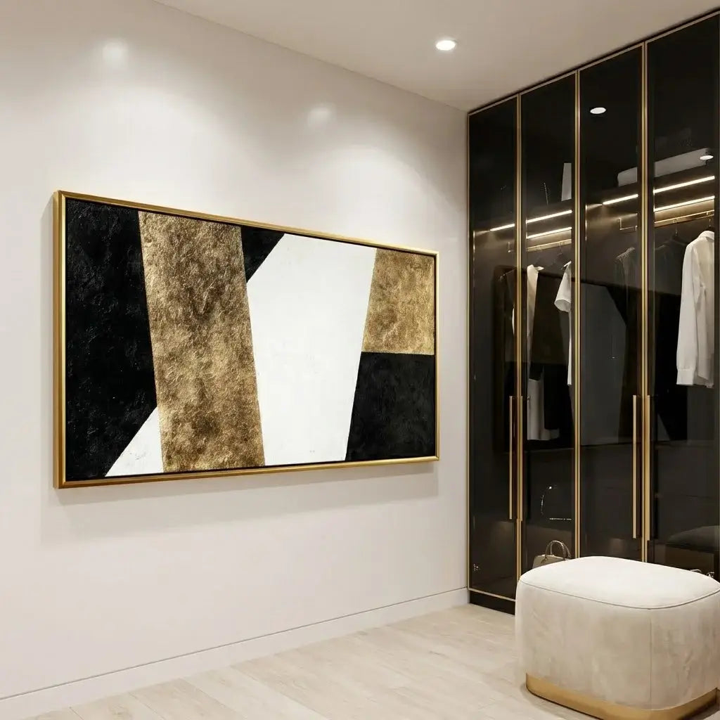 Modern interior with abstract art on a white wall and a wardrobe with reflective doors.