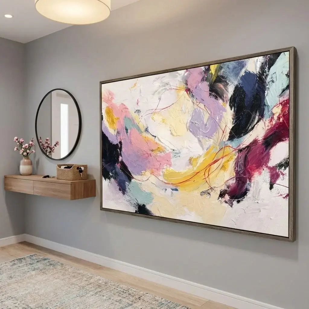 Colorful abstract painting on a wall in a room with a mirror and shelf.