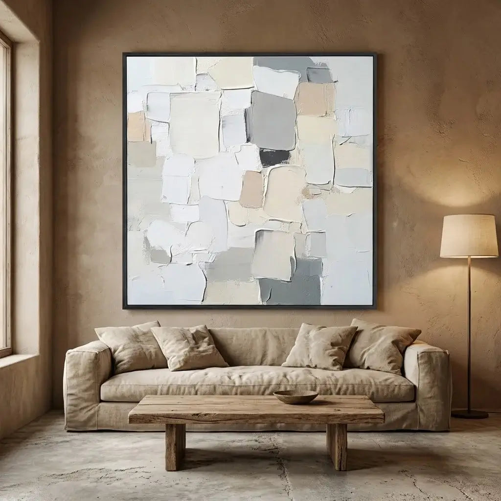 Living room with a beige sofa, wooden coffee table, and abstract art on the wall.