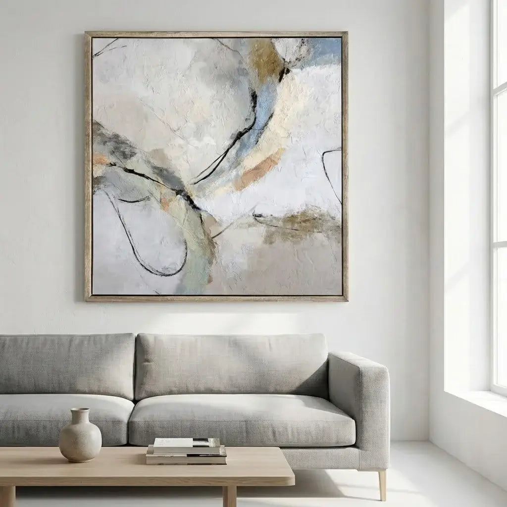 Abstract painting on a wall above a sofa in a modern living room