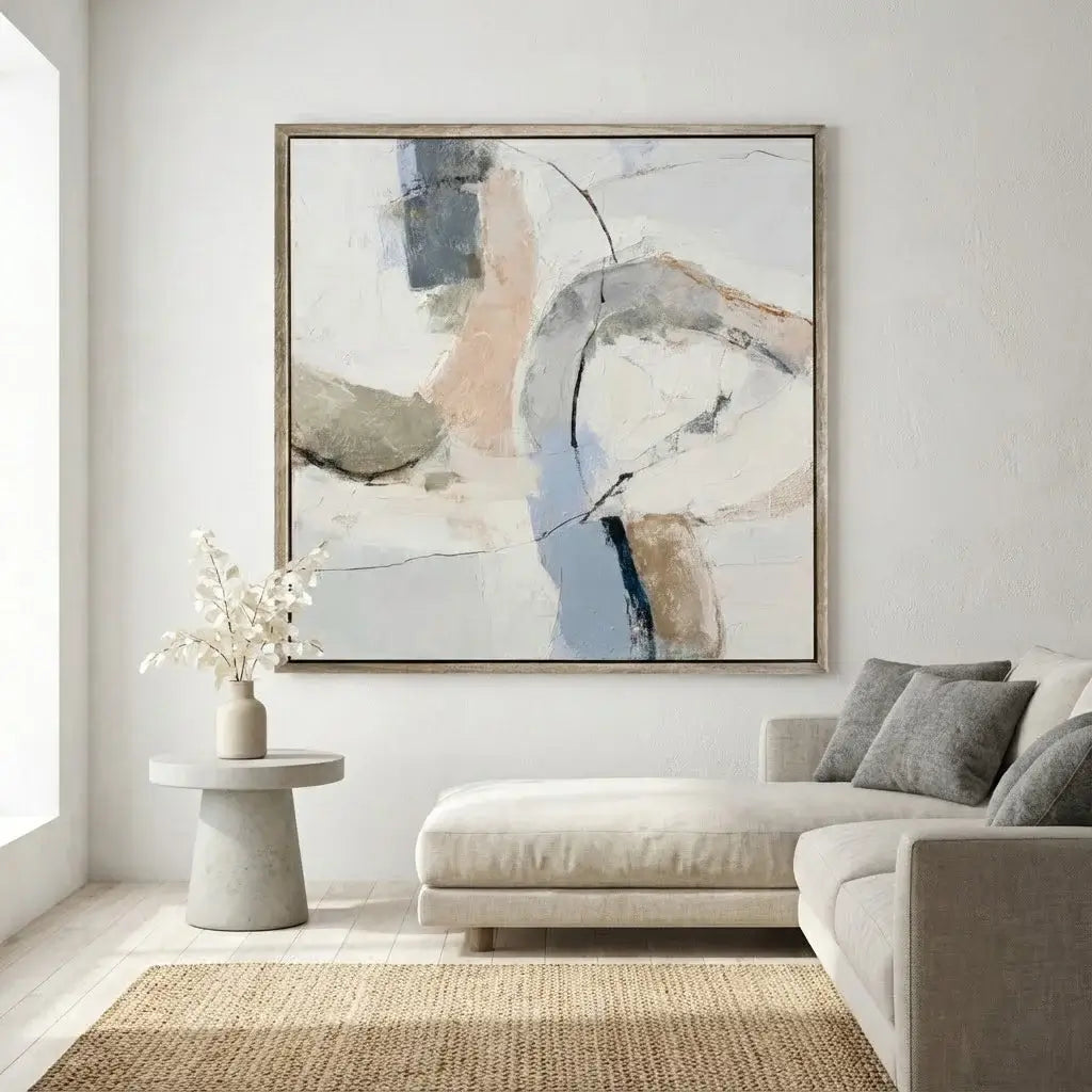 Living room with a modern abstract painting on the wall above a beige sofa.
