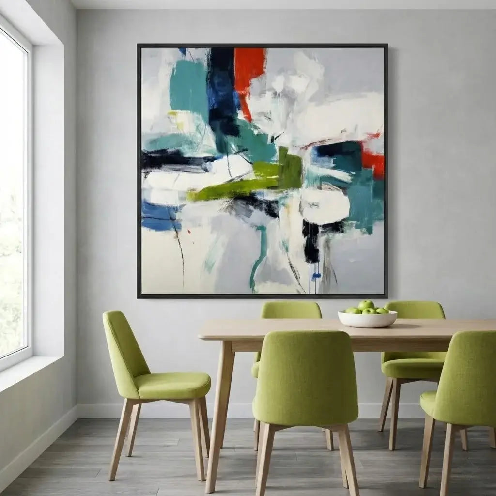 Dining room with a colorful abstract painting on the wall, wooden table, and green chairs.