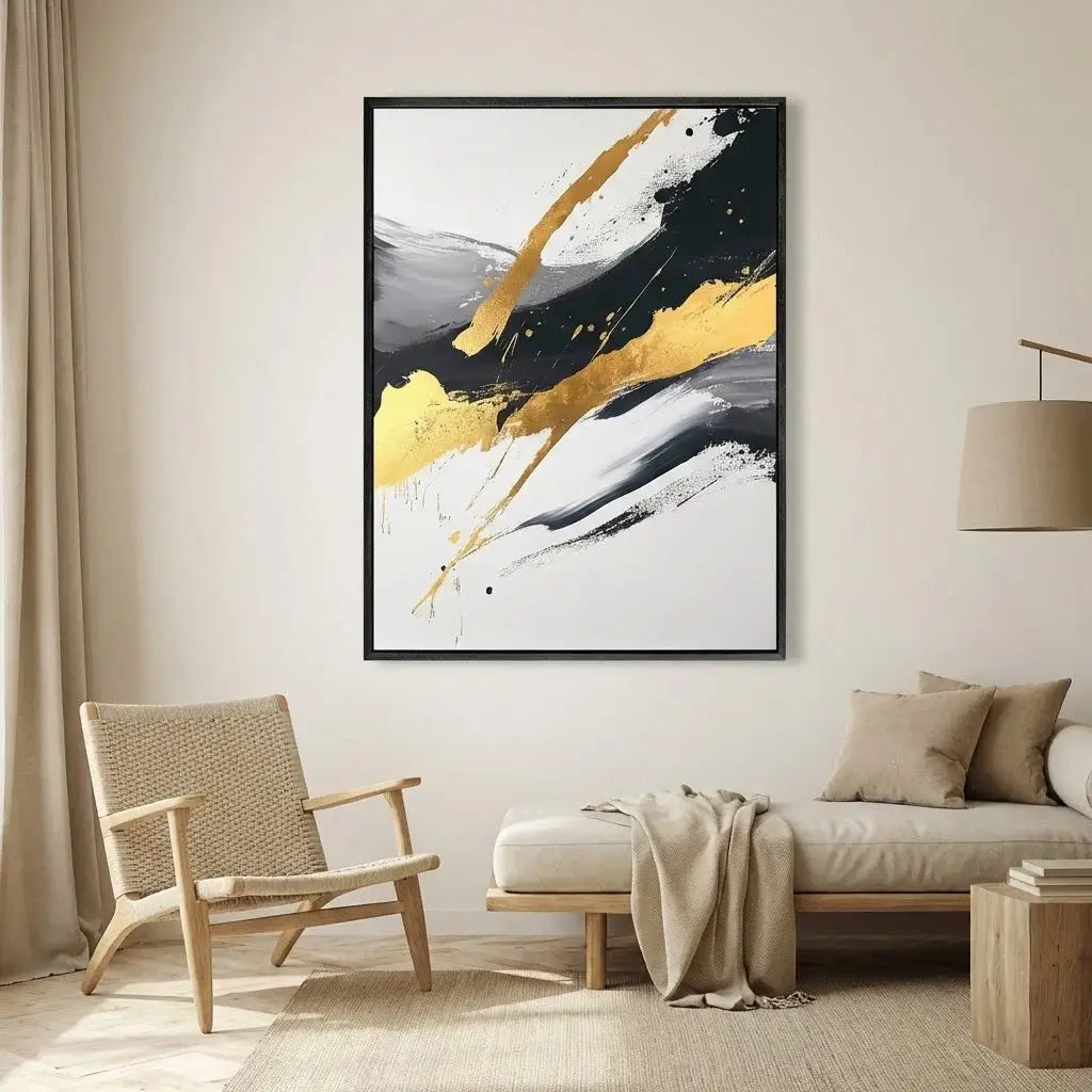 Abstract painting with gold and black splashes in a modern living room.