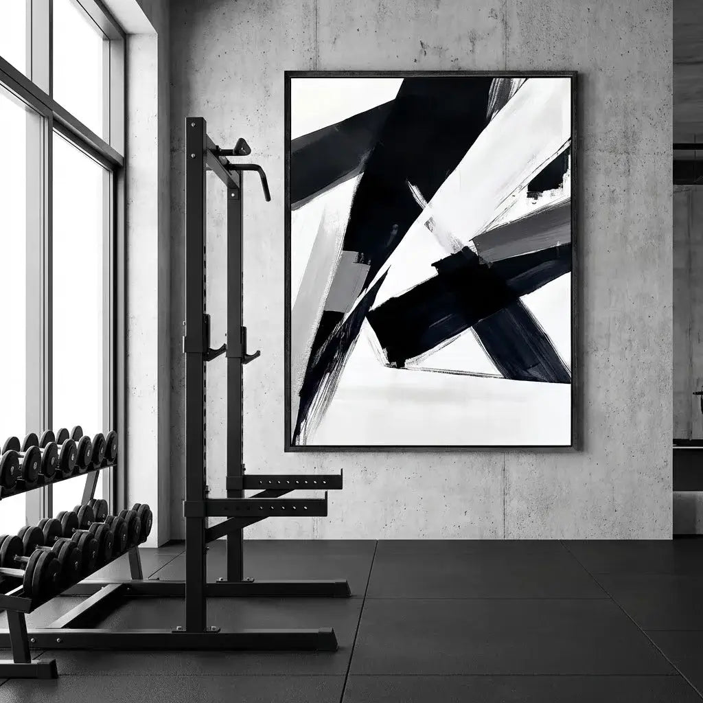 Abstract black and white artwork in a modern gym setting