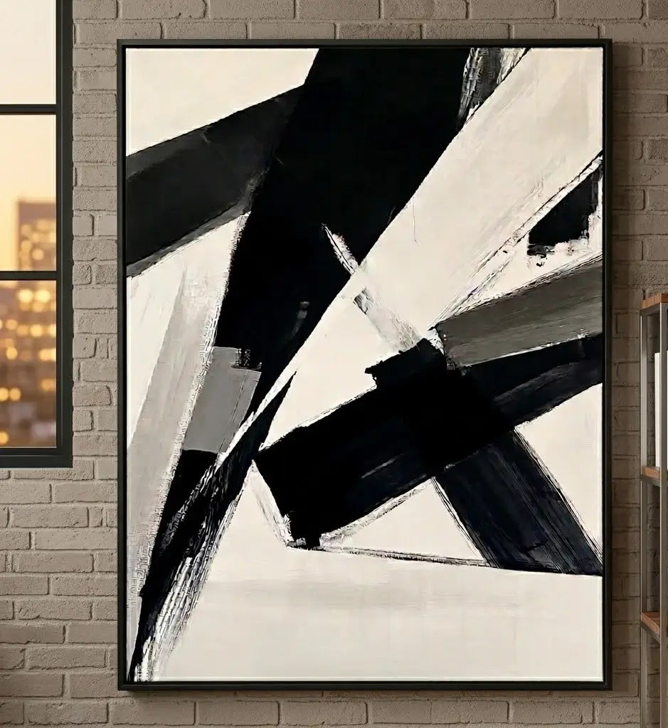 Modern interior with abstract art on the wall, black chair, and side table.