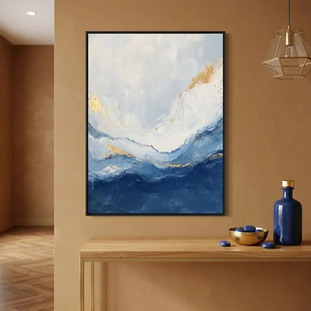 Dining room with abstract art on the wall and a wooden table with blue chairs.