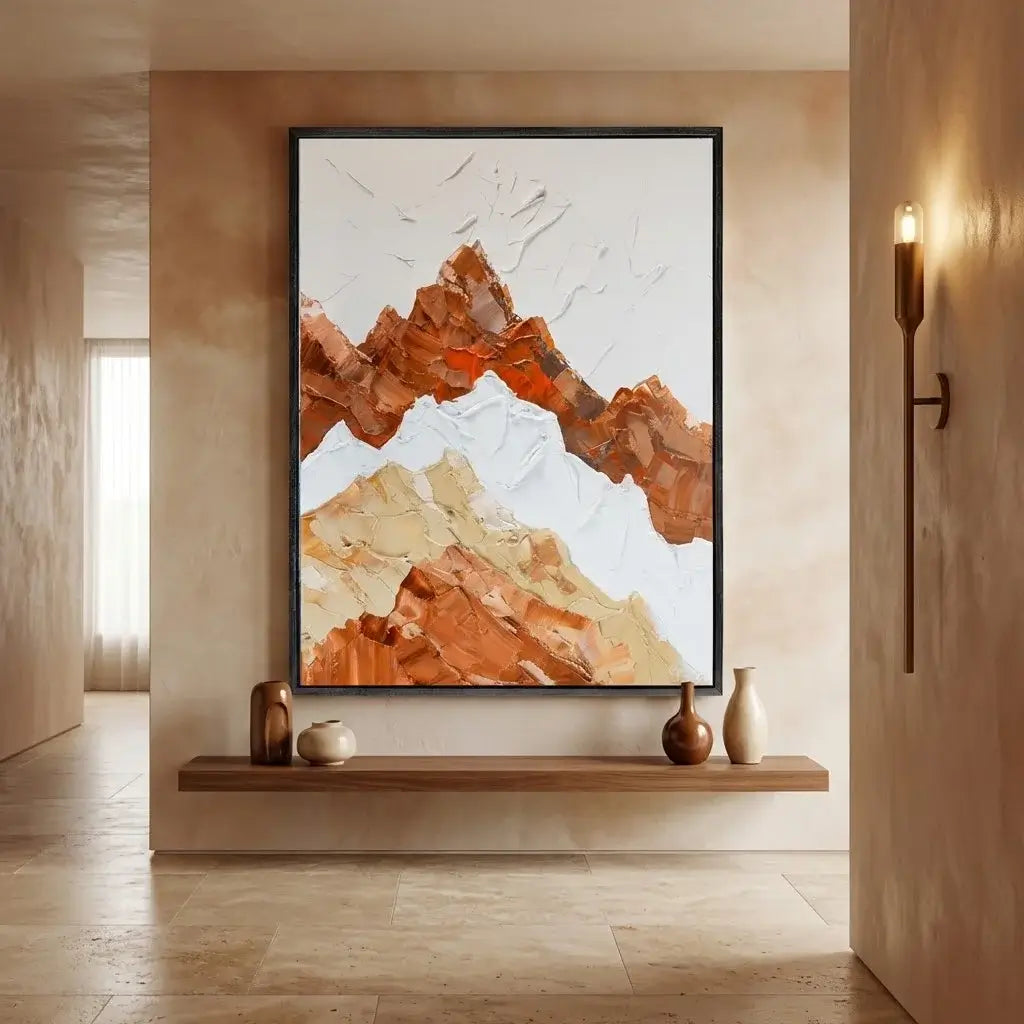 Framed abstract mountain artwork on a wall in a modern interior setting.