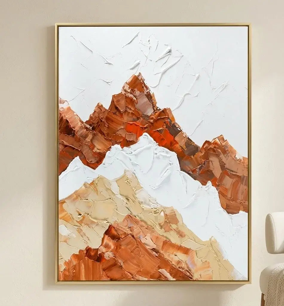 Framed abstract mountain artwork on a wall in a modern interior setting.
