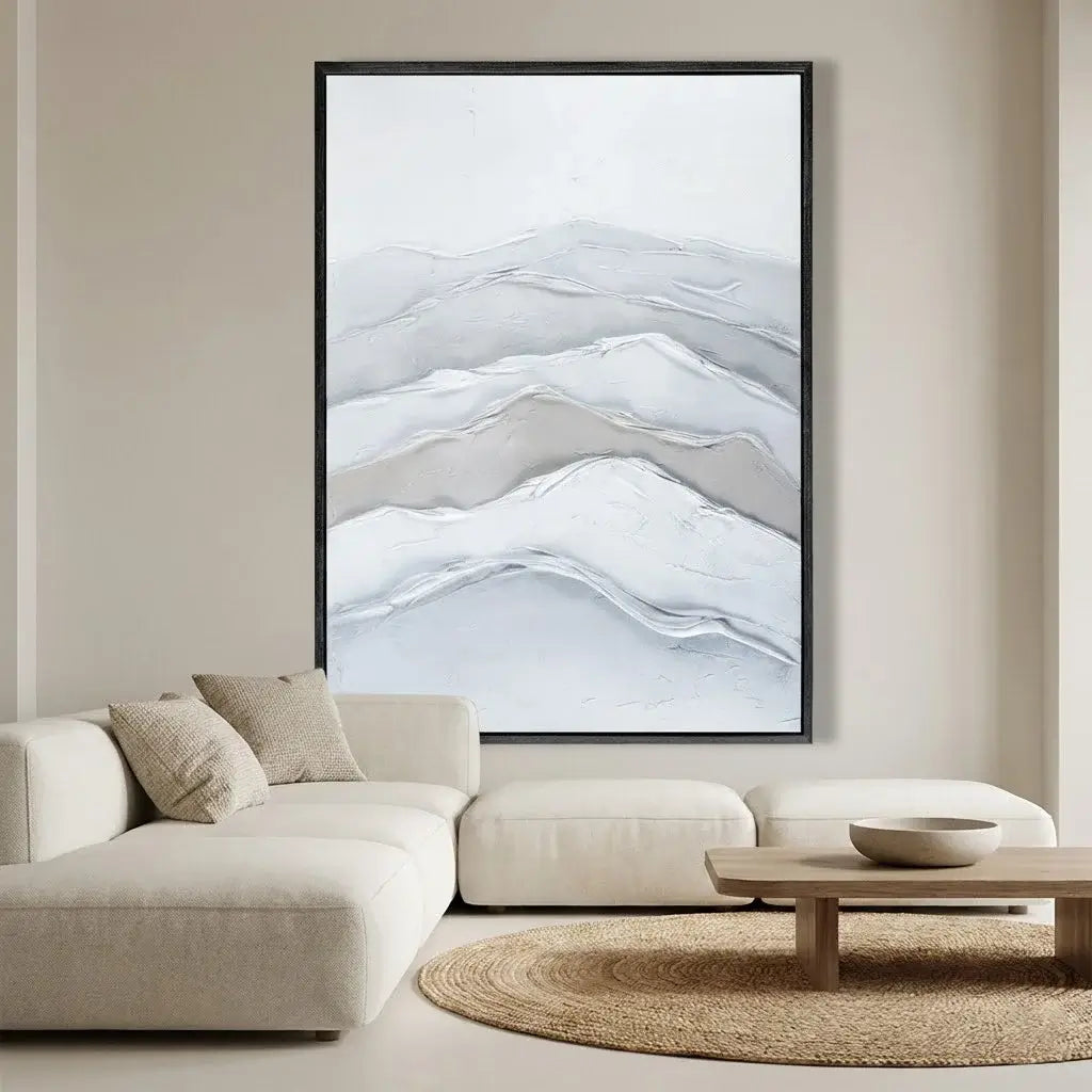 Framed abstract mountain artwork in a modern living room.