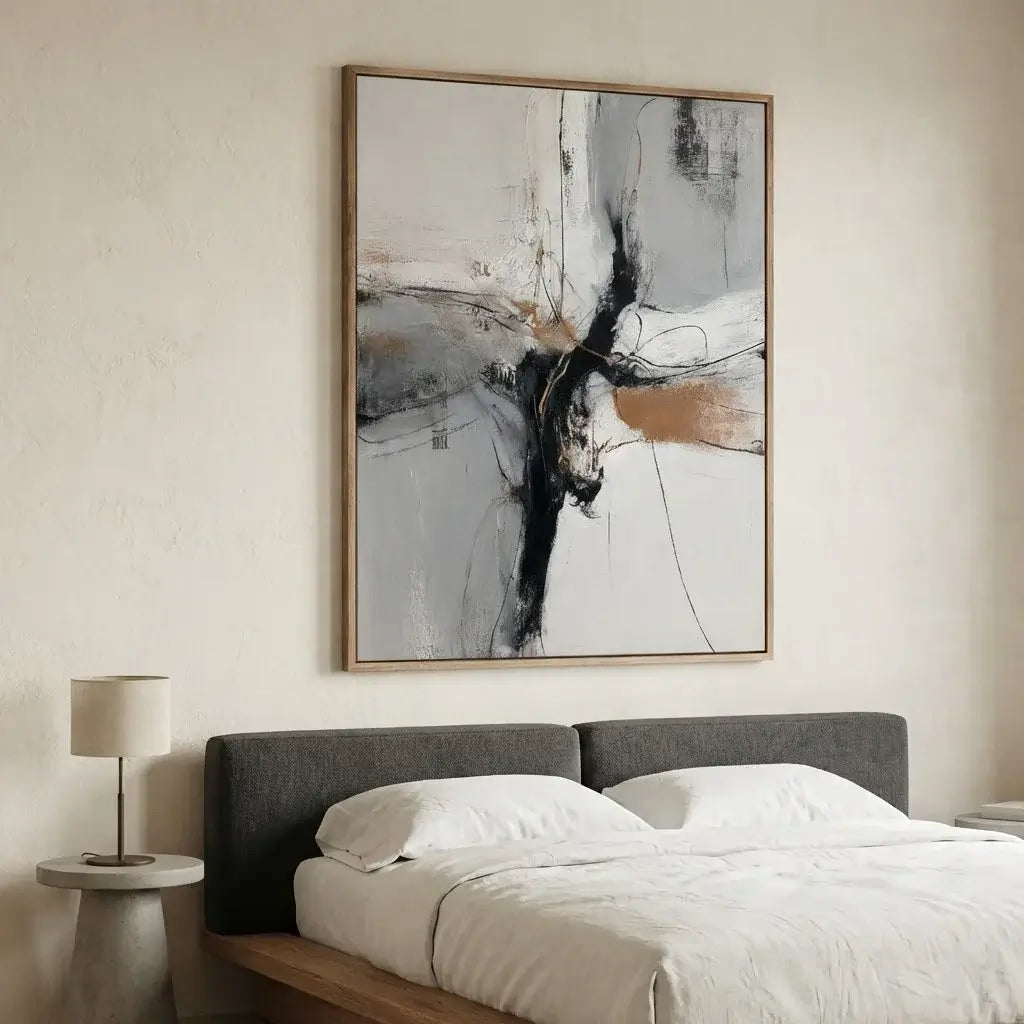 Abstract painting above a bed in a bedroom setting