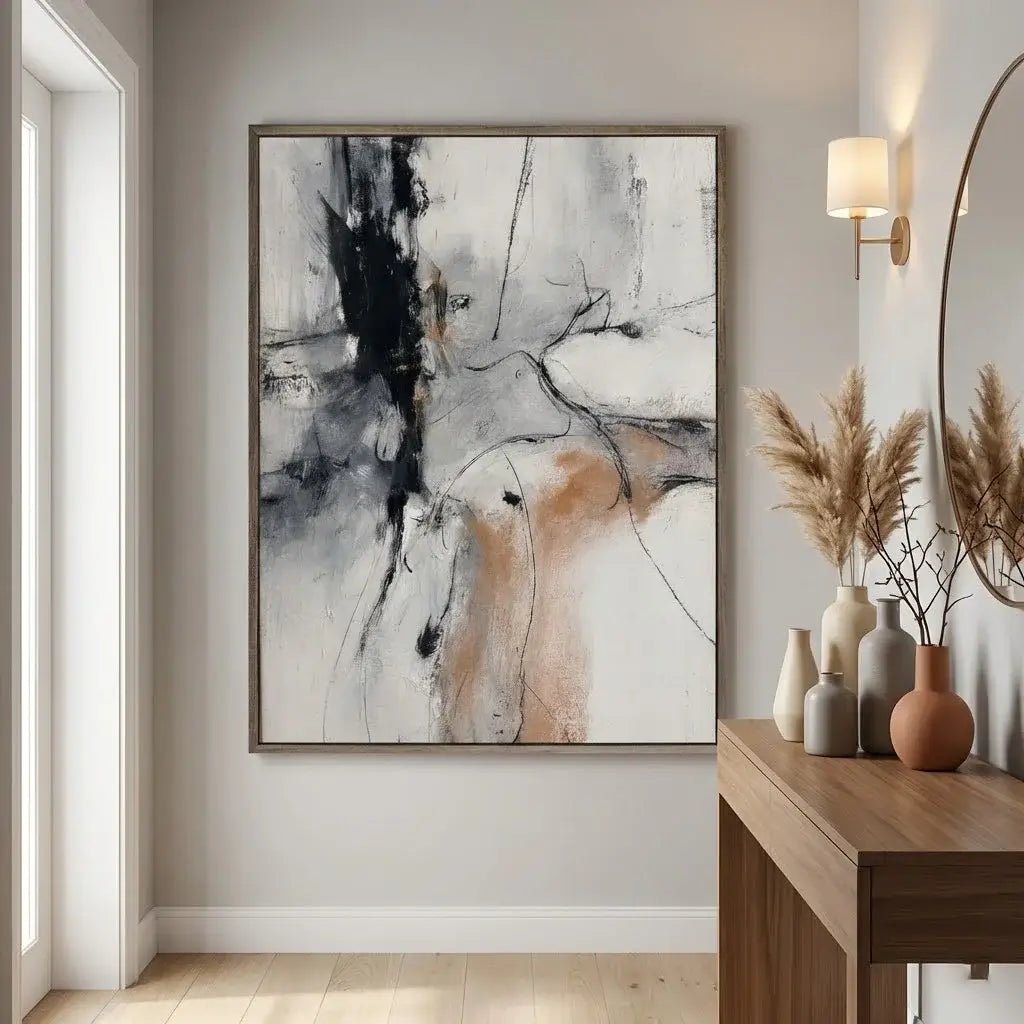 Abstract painting in a modern interior setting with a wooden console table and decorative items.