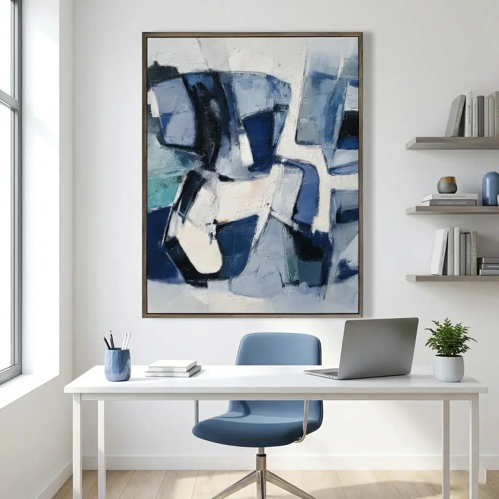 Modern office space with a abstract blue and white painting on the wall.