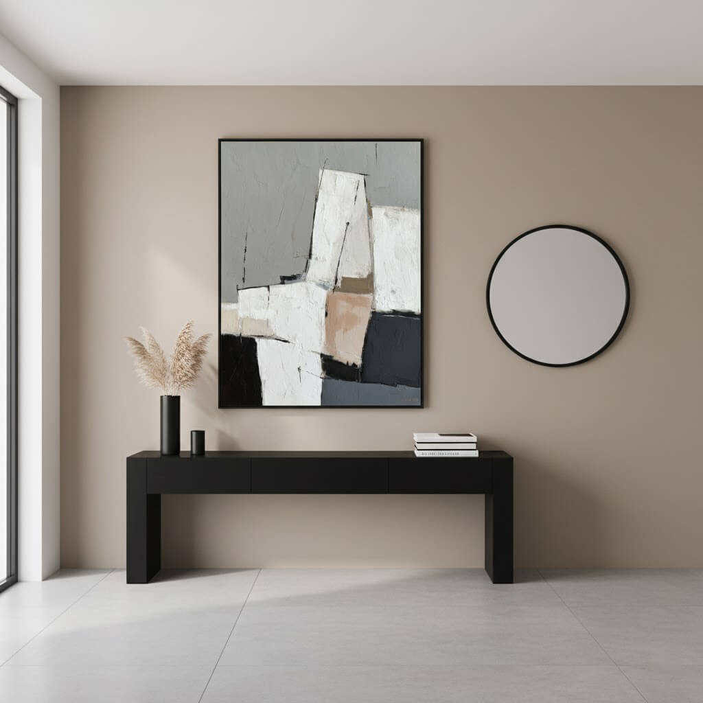 Modern interior with abstract art, round mirror, and black console table.