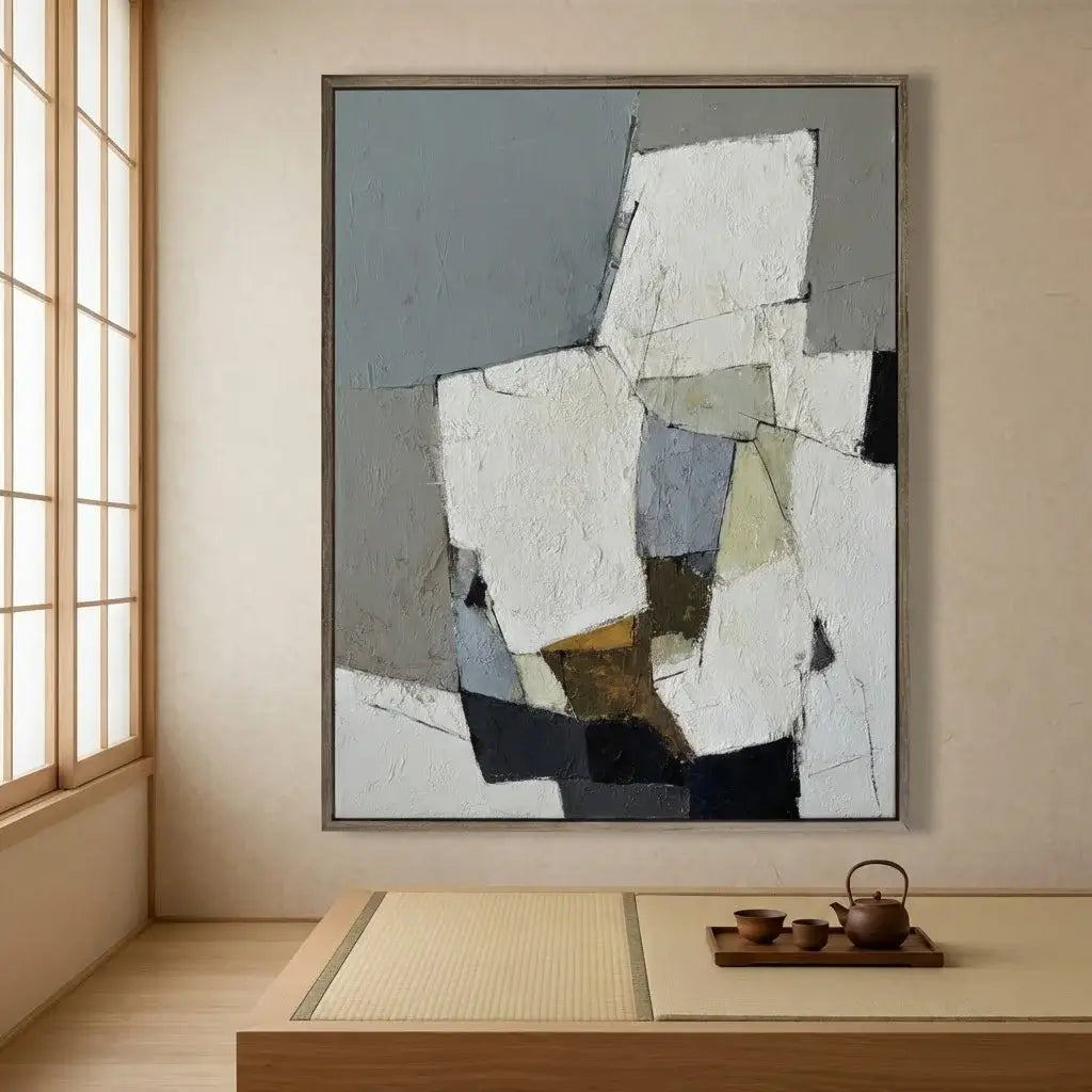 Abstract painting in a modern room with a tea set on a table.