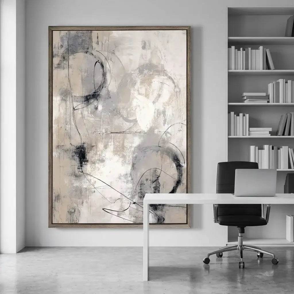 Abstract art piece in a modern office setting with a desk and chair.