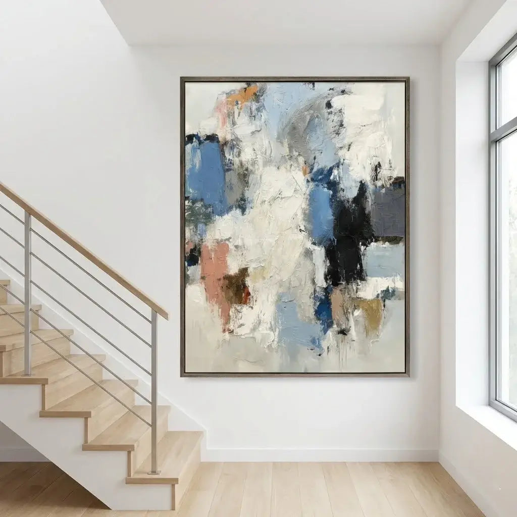 Abstract painting in a modern interior setting with stairs and a window.