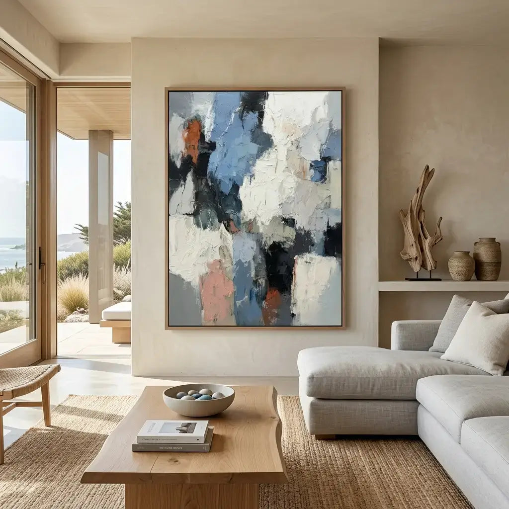 Modern living room with abstract art, sofa, and coffee table.