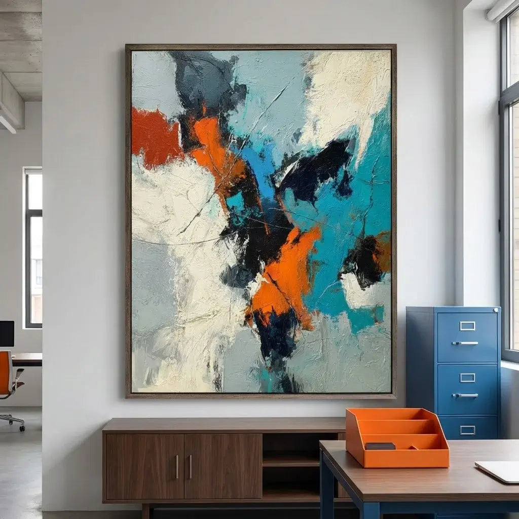 Abstract art painting in a modern office setting with furniture and decor.