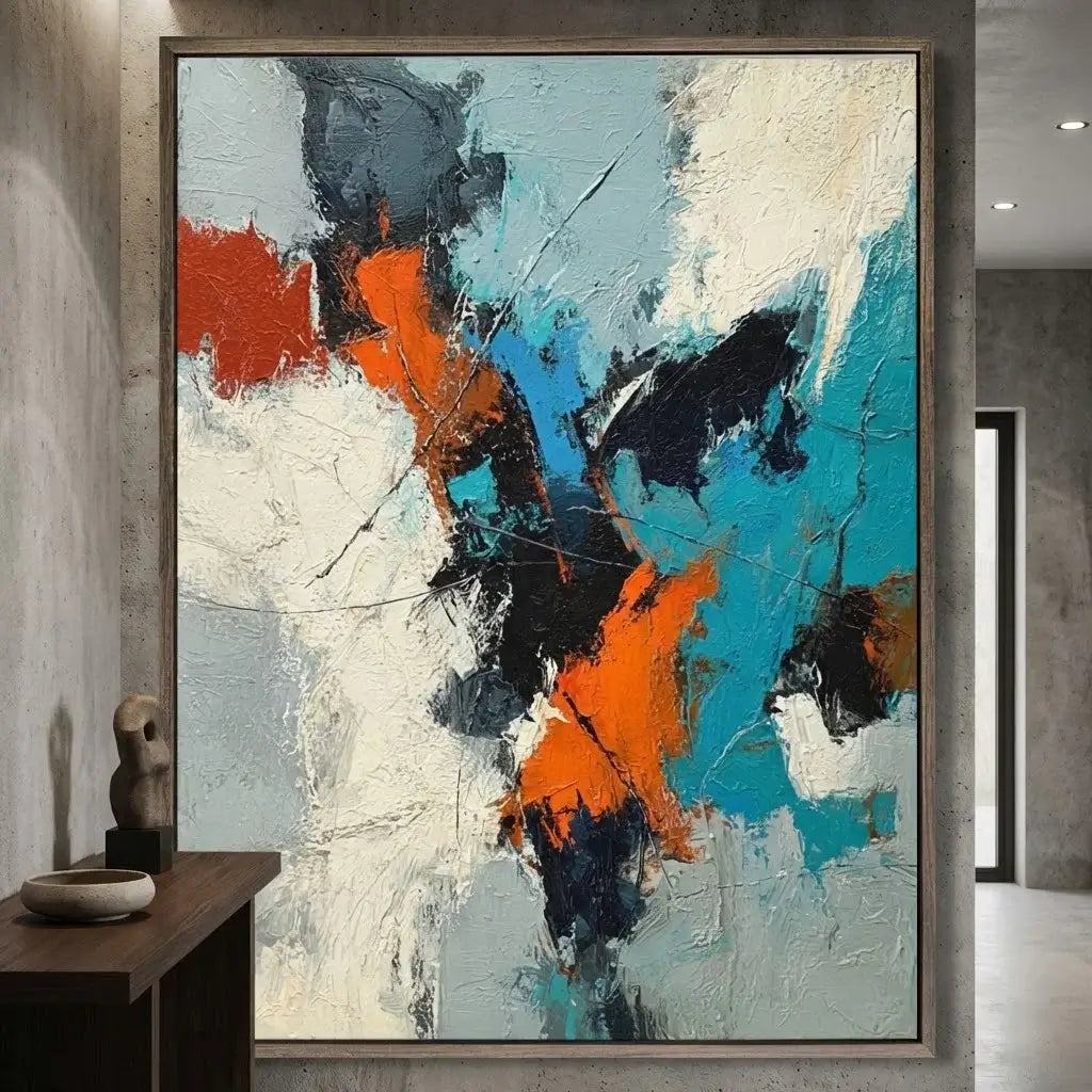 Abstract painting with orange, black, and blue colors in a modern interior setting.
