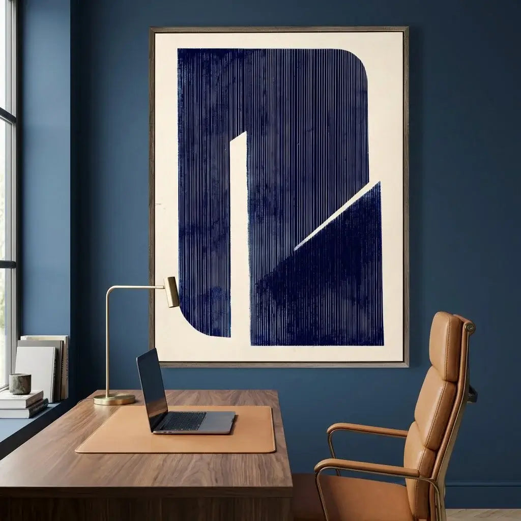 Modern office setup with a desk, chair, and abstract art on a blue wall.