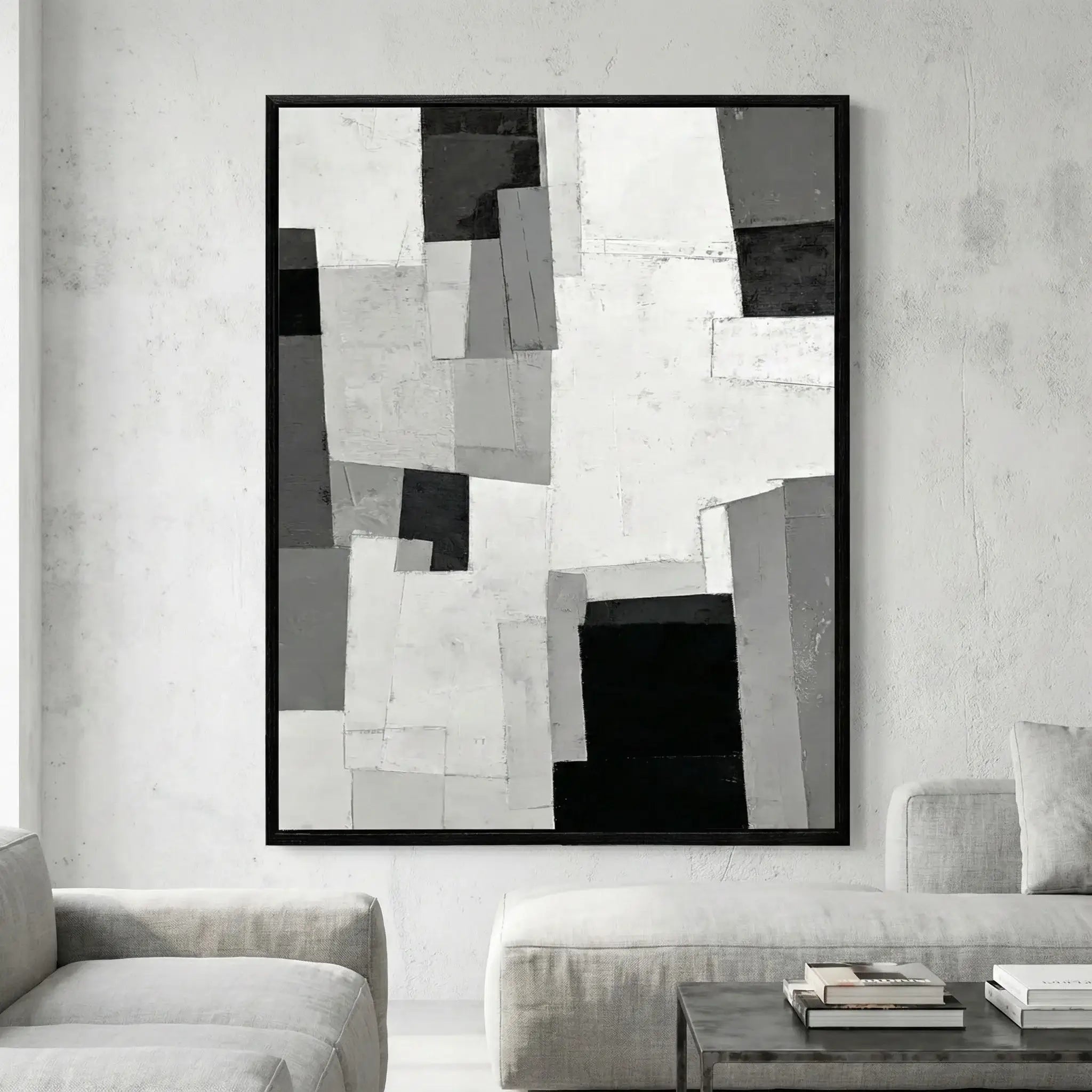 Abstract black and white artwork in a modern living room setting.