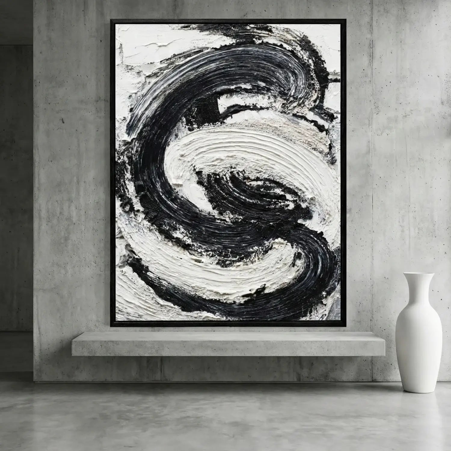 Abstract black and white painting in a modern interior setting with a vase.