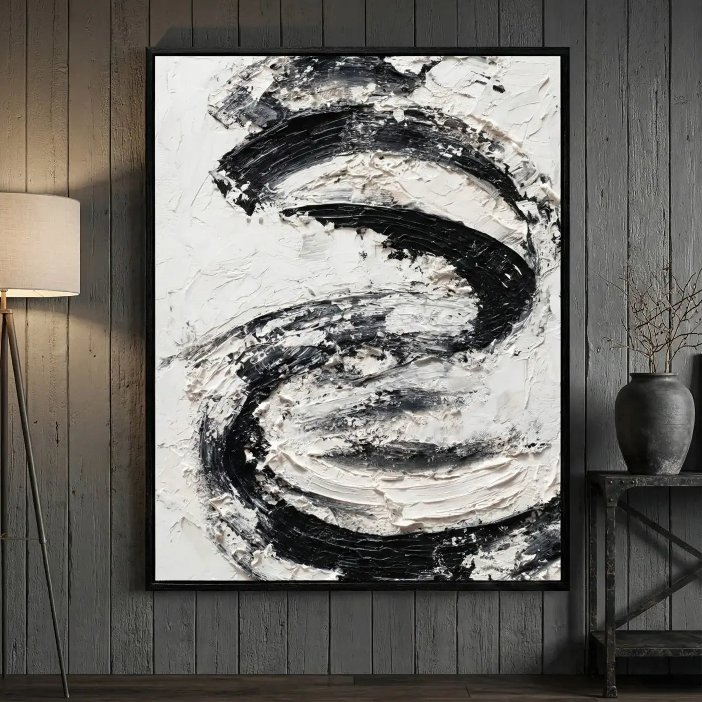 Abstract black and white painting in a modern interior setting.