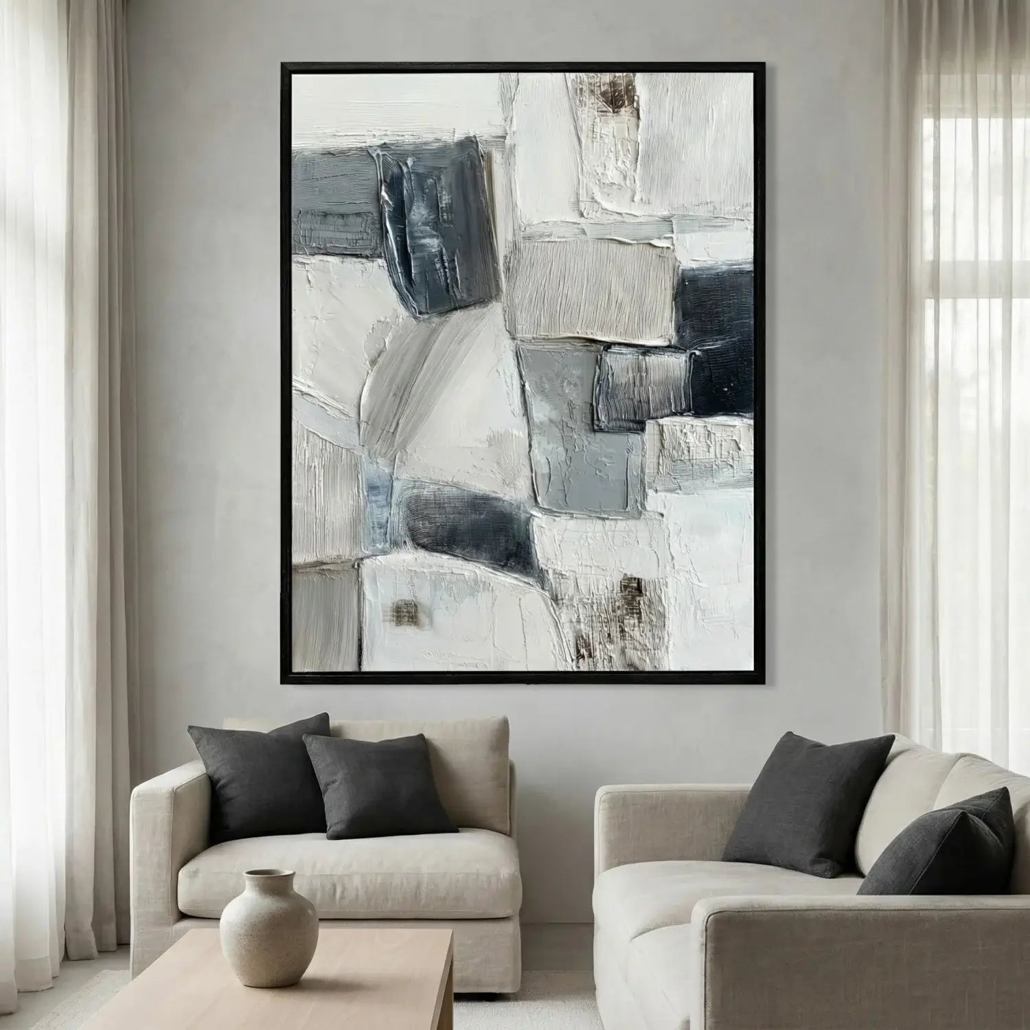 Abstract art piece in a modern living room setting with neutral colors.