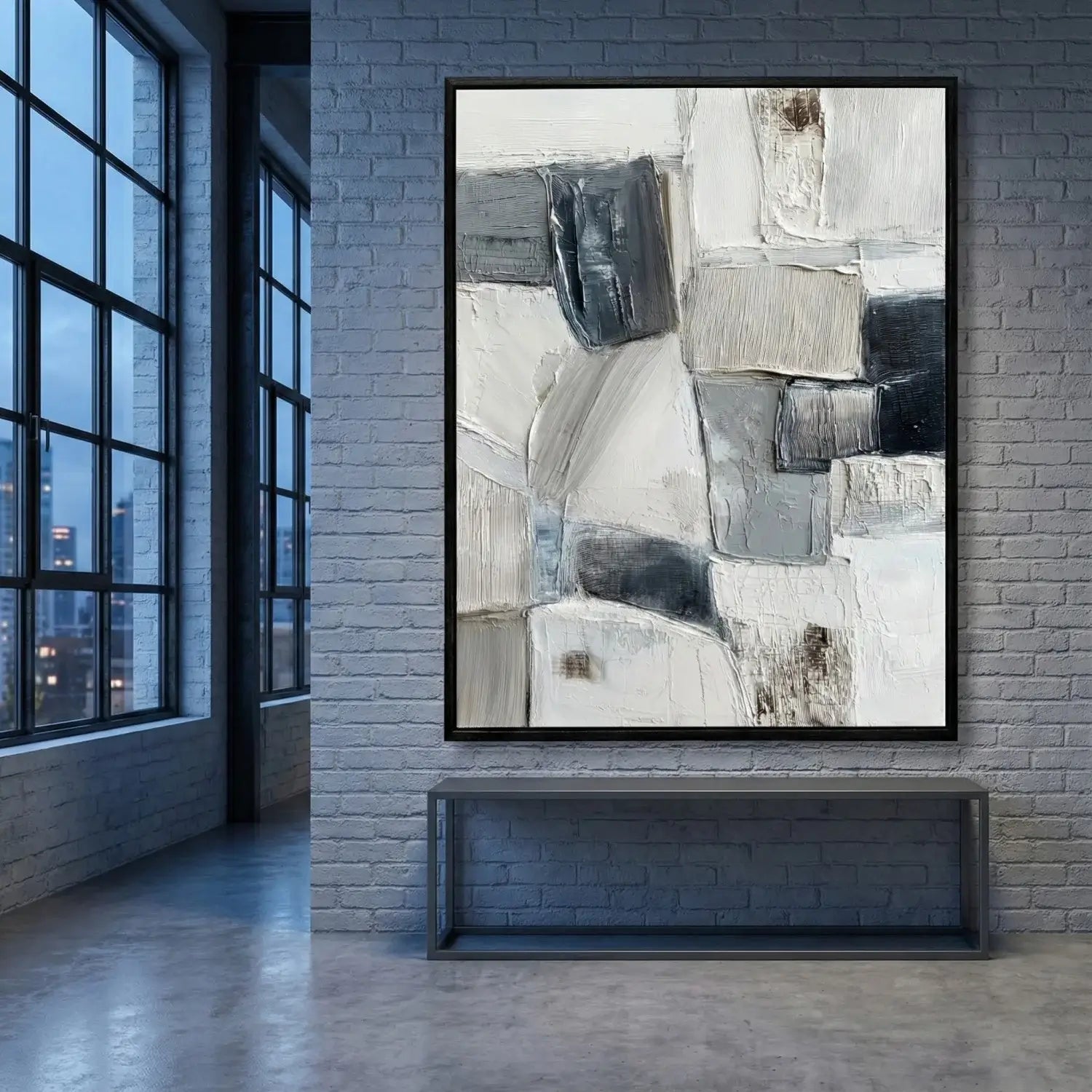 Abstract art piece on a brick wall with large windows