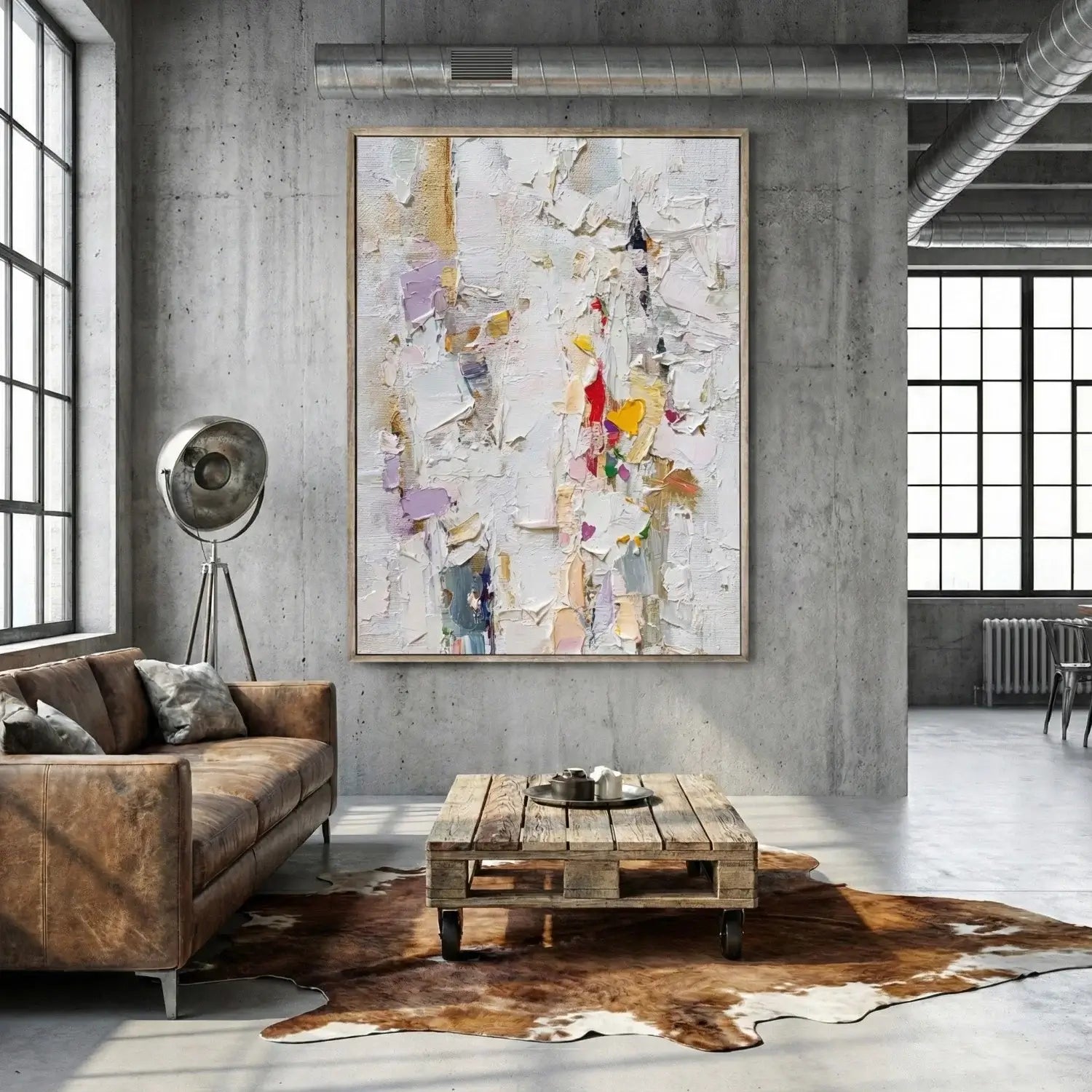 Modern living room with a brown sofa, wooden coffee table, and abstract art on the wall.