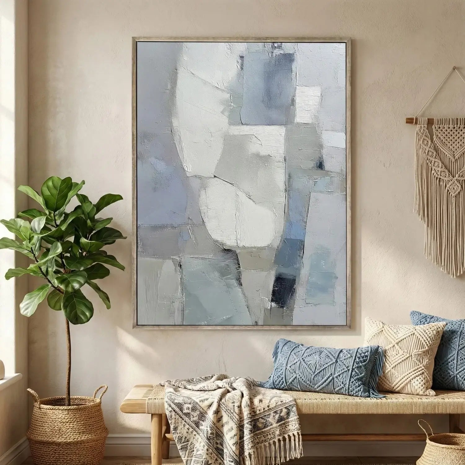 Living room with abstract art, plant, and textured wall hanging