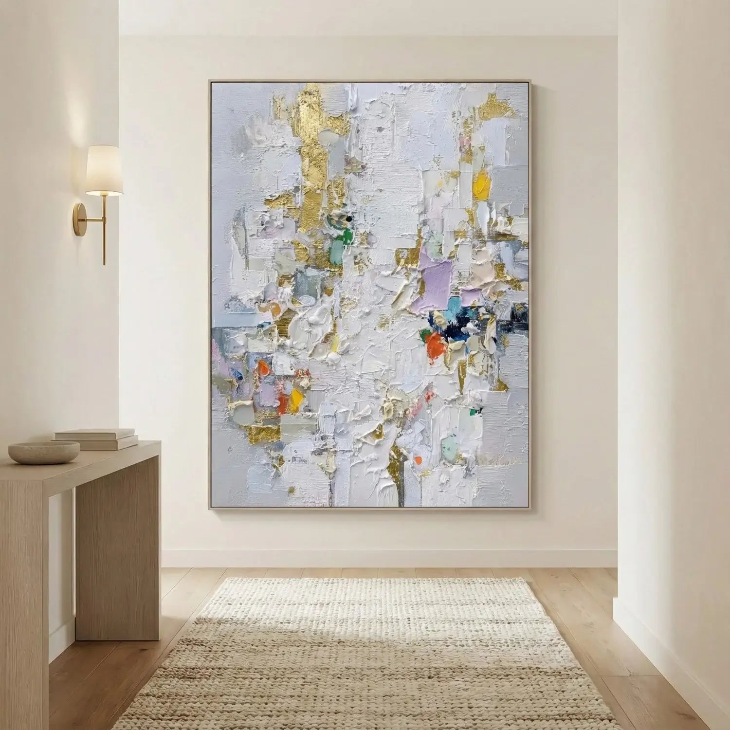 Abstract painting in a modern interior setting with a console table and rug.