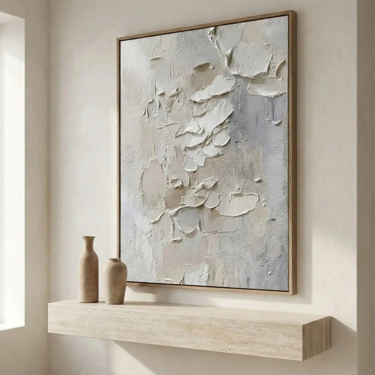 Abstract painting on a wall above a floating shelf with decorative vases.