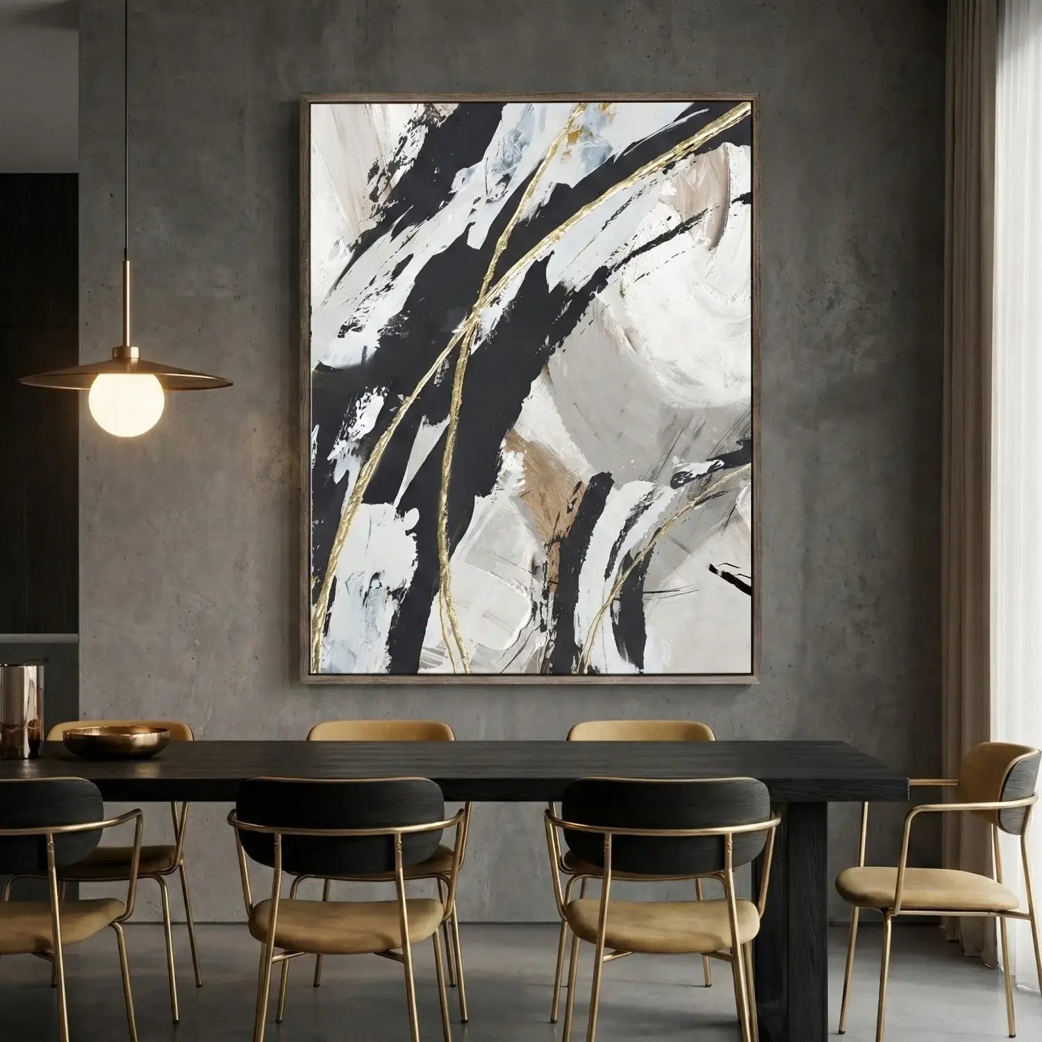 Dining room with abstract art on the wall, black table, and gold chairs.