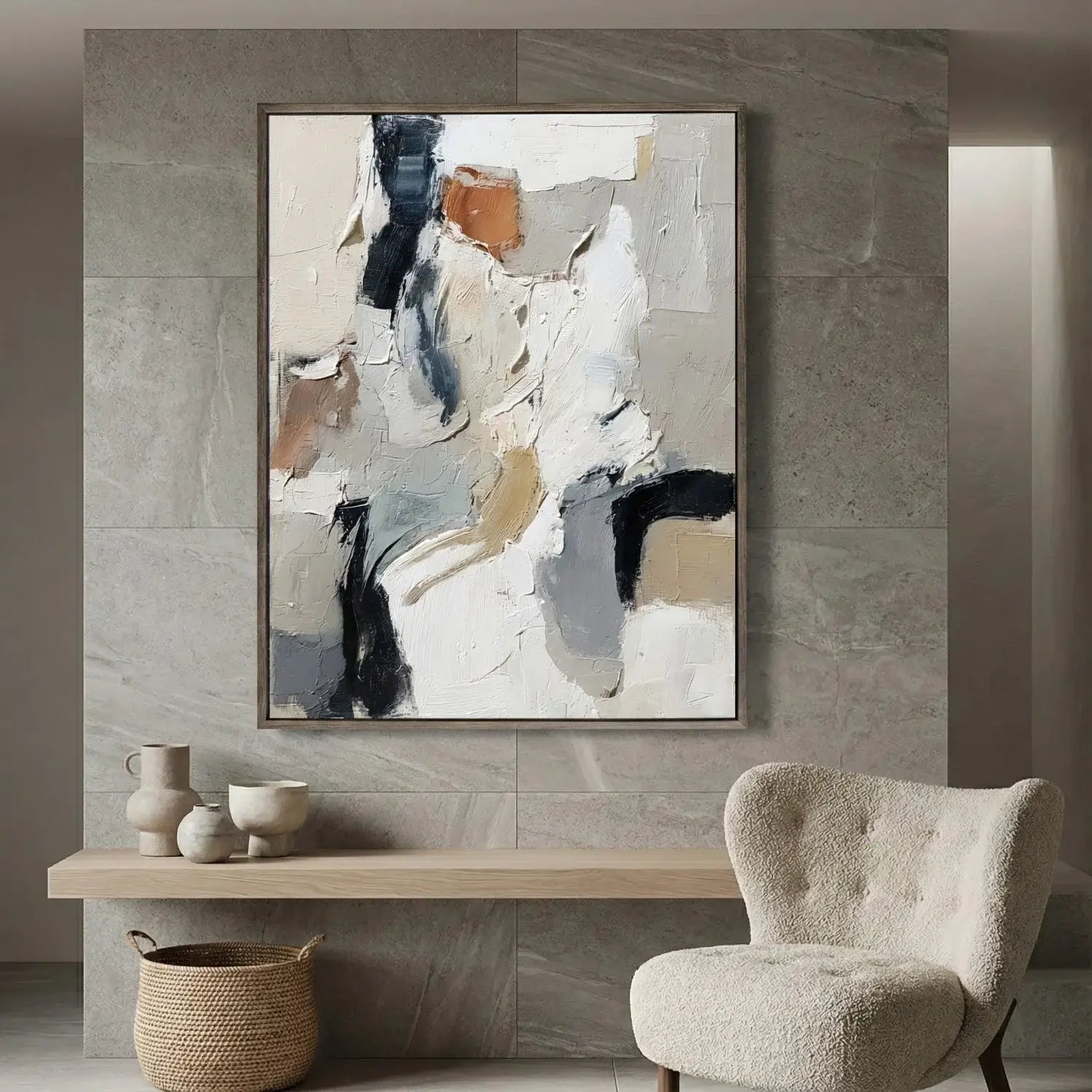 Abstract painting on a wall above a wooden console table with decorative items.