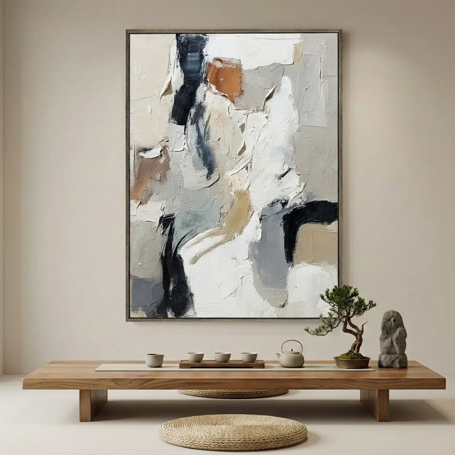 Abstract painting on a wall above a wooden table with decorative items.