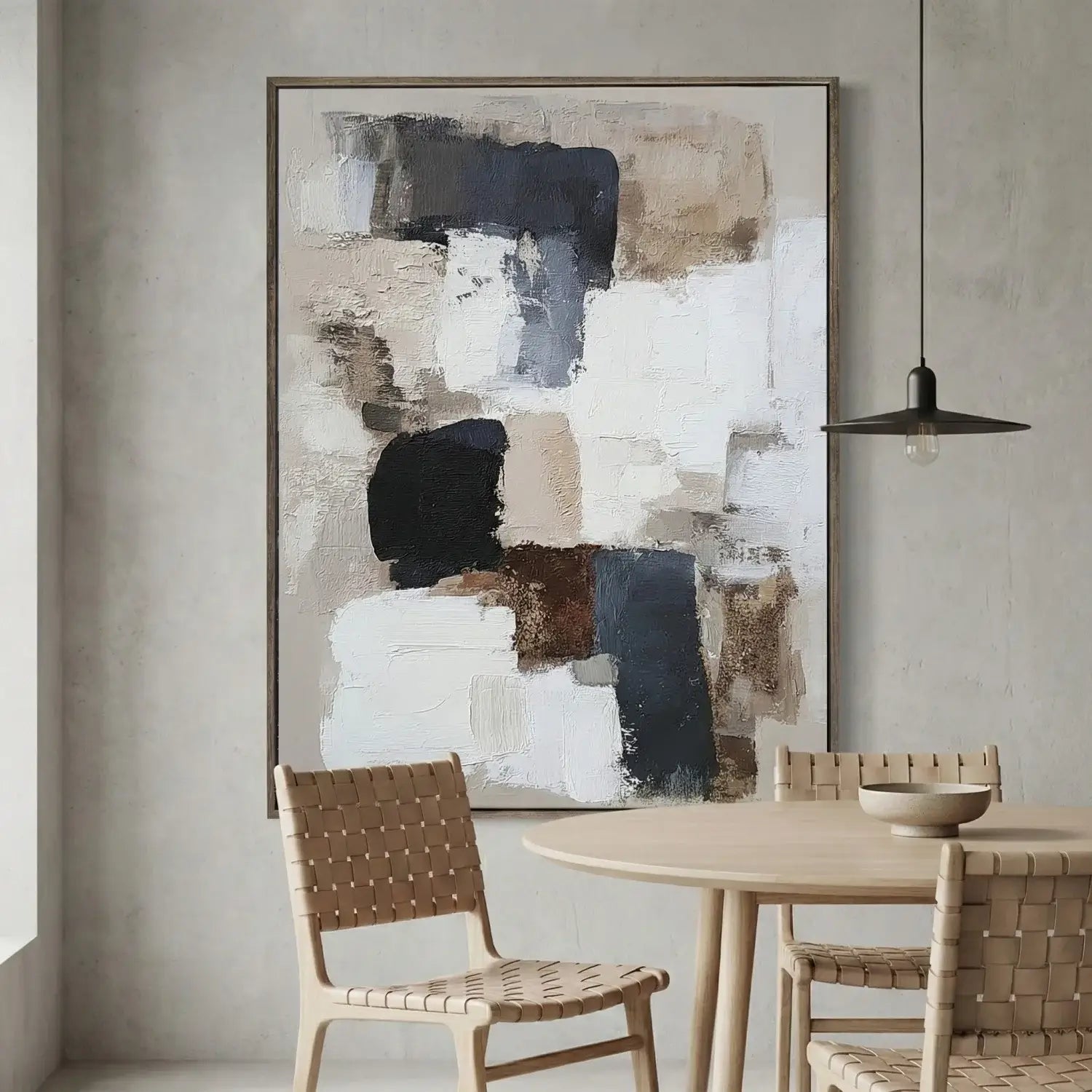 Dining room with abstract art on the wall, wooden table, and chairs.