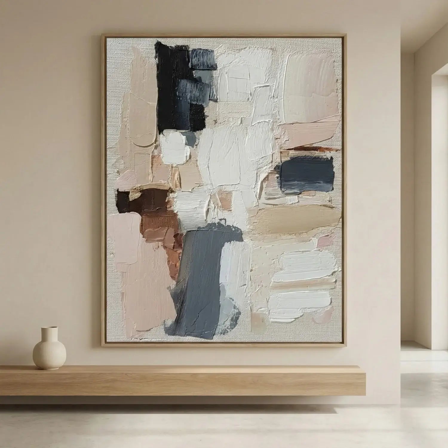 Abstract painting on a wall in a minimalistic room with a vase on a shelf.